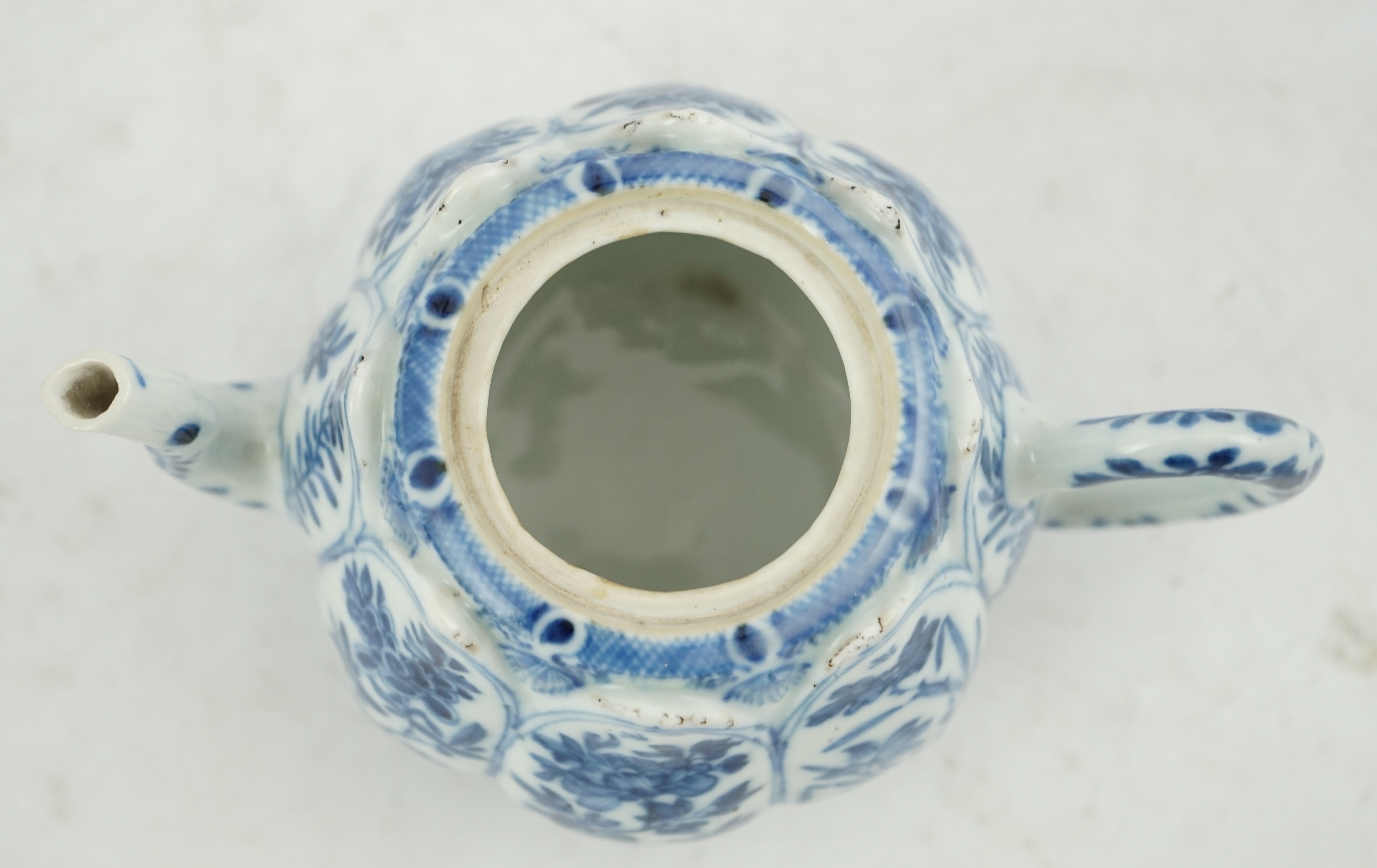 A Chinese blue and white lotus pod-shaped teapot and cover, Kangxi period